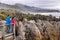 Punakaiki Pancake Rocks tourists couple travel in Paparoa National Park, West Coast, South Island, New Zealand