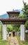 Punakha, Bhutan - September 11, 2016: People passing through gate to Chimi Lhakhang (Monastery of Fertility) in Punakha, Bhutan