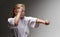 Punch and block of little girl in kimono, karate training