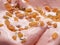 Punch flavour gelato - full frame detail. Close up of pink surface texture of Ice cream covered with pieces of raisins.