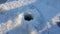 Punch hole borer in ice fishing winter. Fisherman drill on snow and ice of a lake or river. Borer drills ice river or