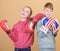 Punching knockout. Childhood activity. Sport success. Friendship fight. workout of small girl and boy boxer in