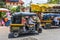 Pune , India - April 26 2015 : Man drives tricycle in front of Saras Baug.