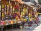 PUNE, INDIA - MARCH 14, 2019: Indian women in traditional dress sell religious bundles of flowers in the colorful stalls in Pune,