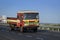 Pune, Maharashtra, India- October 25th, 2016: State transport open truck speeding on highway.