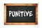 PUNITIVE text written on wooden frame school blackboard