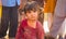 Punjab,Pakistan-April 14,2019:close up of a pakistani little girl sitting on earth looking unhappy