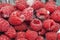 A punnet of expired raspberry fruit