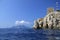 Punta Campanella seen from the sea, in the background the island of Capri and the faraglioni