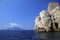 Punta Campanella seen from the sea, in the background the island of Capri and the faraglioni
