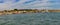 Punta Sabbione landscape at sunset at the mouth of the marina with panorama of Venice in the background