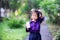 Pupil with milk cartons for morning walk in the park near school. Children drink boxed milk.