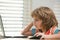 Pupil schoolkid studying homework math during lesson at classroom, education concept, Cute schooler.