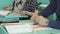 The pupil sitting at the school desk indoors