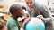 Pupil and teacher looking at a globe