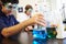 Pupils Carrying Out Experiment In Science Class