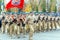 : Pupils of the center of patriotic education of Sergey Plotnikov. `Russia Loyal Sons` in the procession of the square. Text in