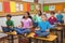 Pupils meditating on classroom desks