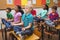 Pupils meditating on classroom desks