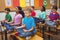 Pupils meditating on classroom desks