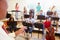 Pupils Playing Musical Instruments In School Orche