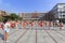 Pupils practice to play drum at the school square