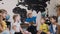 Pupils sit in circle on floor on the pillows as teacher reads to them interesting book in class at primare school or