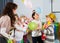 Pupils with teacher amusing with balloons