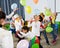 Pupils with teacher amusing with balloons
