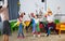 Pupils and teacher in festive hats jumping