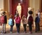 Pupils And Teacher On School Field Trip To Museum With Guide