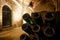 Pupitre and bottles in an underground cellar