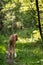 Puppy borzoi walks outdoor at summer day