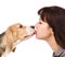 Puppy kisses woman. isolated on white background