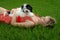 Puppy and pretty girl in grass