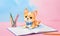 a puppy wearing a bow tie is sitting on top of an open notebook