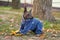 Puppy Xoloitzcuintli in the autumn forest playing