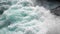 Pure bright turquoise waves break into white foam on the coastal cliffs and seethe between them. The need to protect the