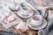 Pure coffee or tea set. A pair of elegant porcelain light gray and pastel pink cups on a cozy background