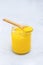 Pure desi ghee in a jar with wooden spoon