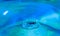 Pure water droplet splashing on water surface forming beautiful shapes abstract concept blue hue photo