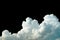 Pure white cumulus clouds on black background. Cloudscape background. White fluffy clouds on dark background. Soft cotton feel of