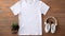 a pure white t-shirt set against a warm wooden texture.
