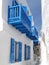 Pure white and vivid blue houses and a small alley at Mykonos town, Greece