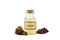 Pure wild natural chaga  Inonotus obliquus mushroom pieces and filtered mushroom mixture in bottle .