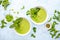 Pureed edamame soup with fresh herbs seasoning  top down view