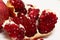 Purified pomegranate fruit on a white background