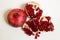 Purified pomegranate fruit on a white background