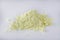 Purified sulfur powder on a white acrylic background