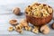 Purified walnuts in a brown wooden bowl